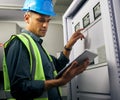 Electrician, engineering and tablet with man in control room for inspection, quality assurance and energy. Electricity