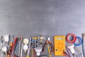 Electrician equipment on metalic background, top view Royalty Free Stock Photo