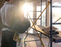 A worker at a construction site holds an electrical cable Royalty Free Stock Photo