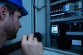 Electrician Examining A Fuse Box