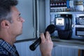 Electrician Examining A Fusebox Royalty Free Stock Photo