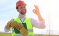 An electrician in the fields near the power transmission line. T Royalty Free Stock Photo