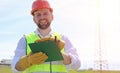 An electrician in the fields near the power transmission line. Royalty Free Stock Photo