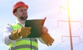 An electrician in the fields near the power transmission line. T Royalty Free Stock Photo