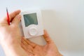 Electrician fitting new thermostat Royalty Free Stock Photo