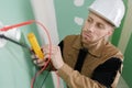 Electrician fitting wiring in house Royalty Free Stock Photo