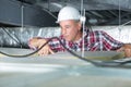 Electrician fixing neon on ceiling Royalty Free Stock Photo