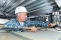 Electrician fixing neon on ceiling Royalty Free Stock Photo