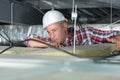 Electrician fixing neon on ceiling Royalty Free Stock Photo