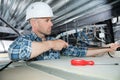 Electrician fixing neon on ceiling Royalty Free Stock Photo