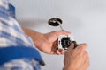 Electrician hands installing wall socket Royalty Free Stock Photo