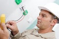 Electrician hands installing wall socket Royalty Free Stock Photo