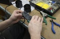 Electrician hands stripping wire connections with a stripper Royalty Free Stock Photo