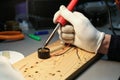 Electrician hands are working with soldering iron in workshop Royalty Free Stock Photo