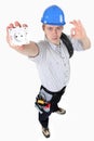 Electrician holding an electrical socket Royalty Free Stock Photo