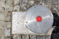 Electrician hydro bollard gray metal with red lamp. Royalty Free Stock Photo