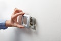 Electrician installing AC power socket Royalty Free Stock Photo