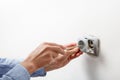 Electrician installing AC power socket Royalty Free Stock Photo