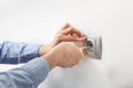 Electrician installing AC power socket Royalty Free Stock Photo