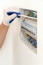 Electrician installing an electrical fuse box . Royalty Free Stock Photo