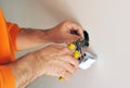 Electrician installing electrical switches in the new house Royalty Free Stock Photo