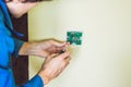 Electrician installing an electrical thermostat in a new house Royalty Free Stock Photo