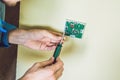 Electrician installing an electrical thermostat in a new house Royalty Free Stock Photo