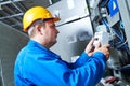 Electrician installing energy saving meter Royalty Free Stock Photo