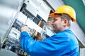 Electrician installing energy saving meter Royalty Free Stock Photo