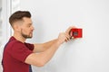 Electrician installing fire alarm system Royalty Free Stock Photo