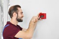 Electrician installing fire alarm system Royalty Free Stock Photo