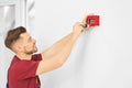 Electrician installing fire alarm system Royalty Free Stock Photo