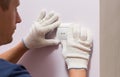 Electrician installing light switch, close up photo Royalty Free Stock Photo