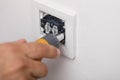 The electrician installing the light switch. tool Royalty Free Stock Photo