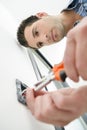 Electrician installing light switch Royalty Free Stock Photo