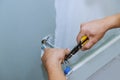 Electrician installing new current socket in new house construction site Royalty Free Stock Photo