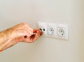Electrician installing power sockets in the house Royalty Free Stock Photo