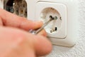 Electrician installing socket