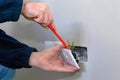 Electrician installing a socket