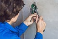 Electrician Installing Socket In New House Royalty Free Stock Photo