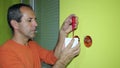 Electrician Installing Switch on the Wall