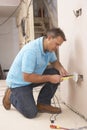 Electrician Installing Wall Socket