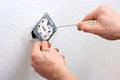 Electrician installing wall socket Royalty Free Stock Photo