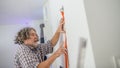 Electrician installing wiring in a wall Royalty Free Stock Photo