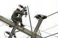 Electrician lineman repairman worker at climbing work Royalty Free Stock Photo