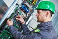 Electrician make maintenance in engine room of elevator Royalty Free Stock Photo