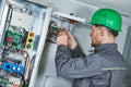 Electrician make maintenance in engine room of elevator Royalty Free Stock Photo