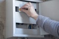 The electrician makes the connection in the prefabricated panel. Repair of electrical equipment