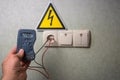 Electrician makes electrical measurements; jumps tension, elect Royalty Free Stock Photo