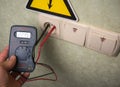 Electrician makes electrical measurements; jumps tension, elect Royalty Free Stock Photo